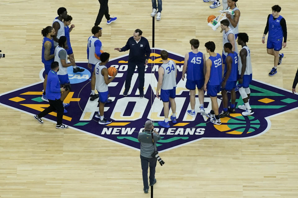 Duke head coach Mike Krzyzewski talks with his team after practice for the men's Final Four NCAA college basketball tournament, Friday, April 1, 2022, in New Orleans. (AP Photo/David J. Phillip)