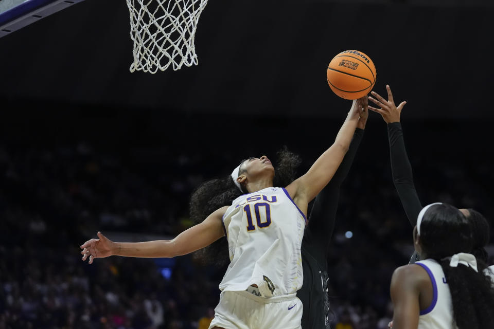 LSU forward Angel Reese (10) leaps for a rebound during the second half of a first-round college basketball game against Rice in the women's NCAA Tournament in Baton Rouge, La., Friday, March 22, 2024. LSU won 70-60. (AP Photo/Gerald Herbert)