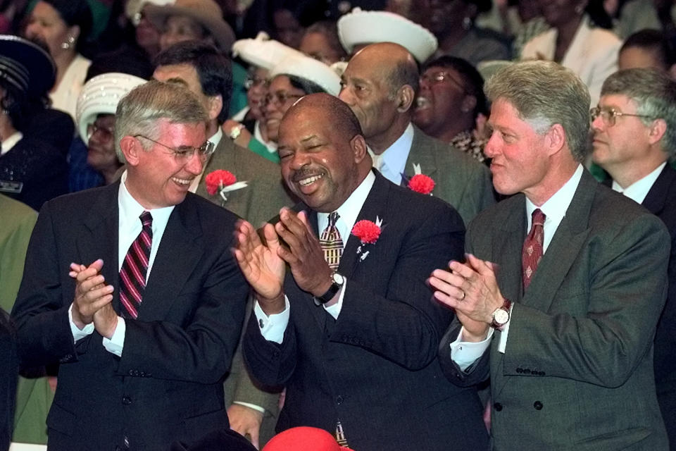 FILE - In this Sunday, Nov. 1, 1998 file photo, President Clinton, Rep. Elijah Cummings, D-Md., center, and Maryland Gov. Parris Glendening, left, participate in church services at New Psalmist Baptist Church in Baltimore, Md. Clinton urged members of the church Sunday to turn out in large numbers and support his party's candidates on Election Day. (AP Photo/Greg Gibson)