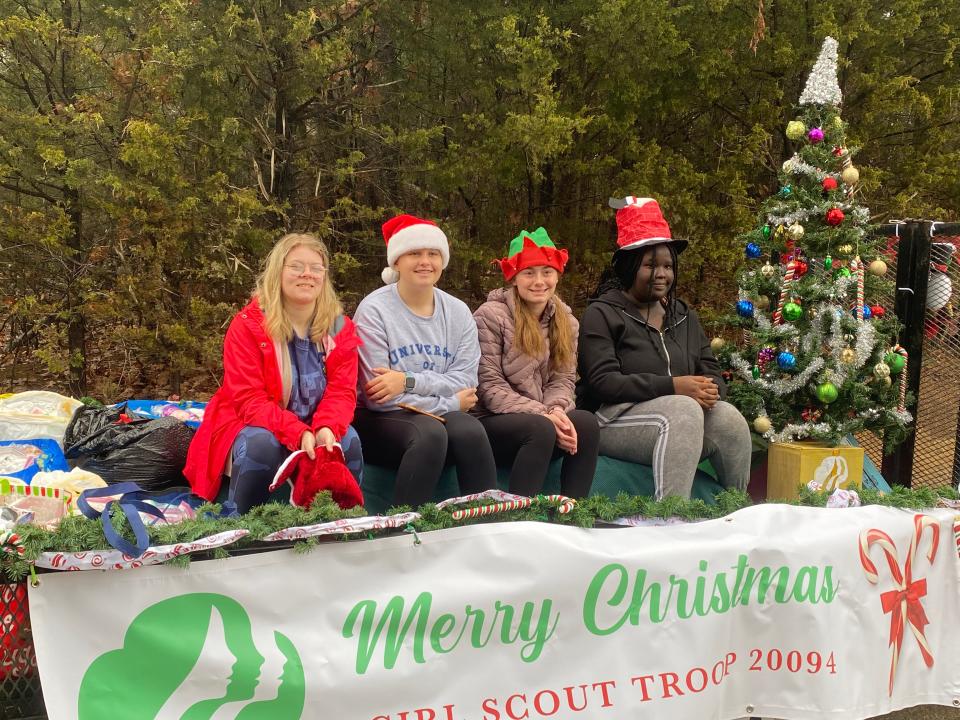 From left, Girl Scout Troop 20094 members Ashlyn Wilkerson, Ella Wolfe, Sarah Brown, and Iteng Lohure participate in the Luttrell Christmas parade in December 2022.