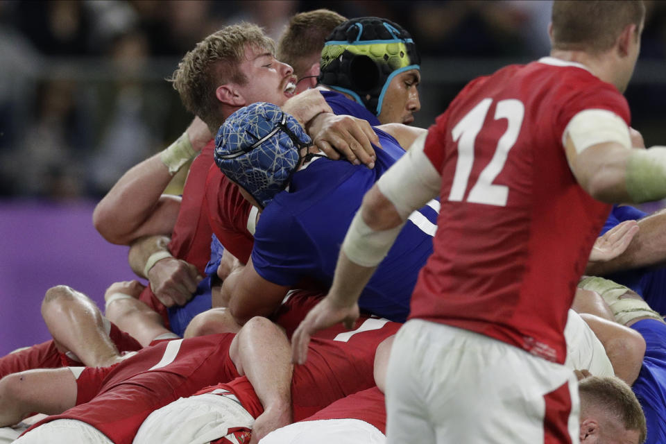 France's Sebastien Vahaamahina, wearing a black helmet, receives a red card after the play during the Rugby World Cup quarterfinal match at Oita Stadium between Wales and France in Oita, Japan, Sunday, Oct. 20, 2019. (AP Photo/Aaron Favila)