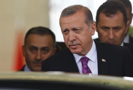 Turkish President Tayyip Erdogan (C) looks on after arriving at Esenboga Airport, in Ankara, Turkey, June 8, 2015. REUTERS/Umit Bektas