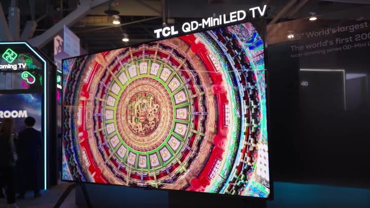 A brightly colored mandala shown on a TCL  qm89 TV. 