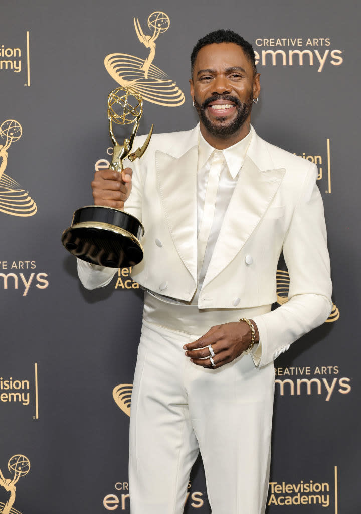 Domingo holding an award