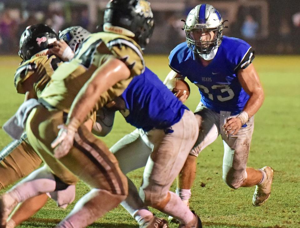 Bartram Trail's Laython Biddle (33) looks for running room on his way to a touchdown against Buchholz in the teams' 2022 playoff meeting.