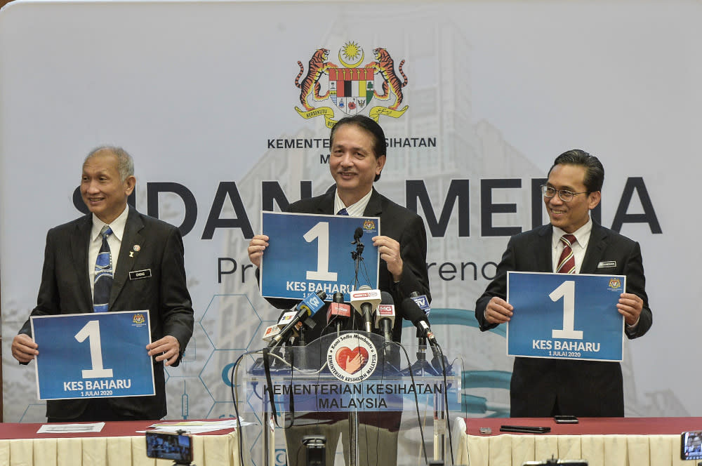 Health director-general Datuk Dr Noor Hisham Abdullah holding a poster showing the number of cases reported July 1, 2020 — Picture by Shafwan Zaidon