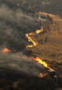 <p>Members of hand crew work on the fire line near Placenta Canyon Road in Santa Clarita, Calif., July 24, 2016. (AP Photo/Ringo H.W. Chiu)</p>