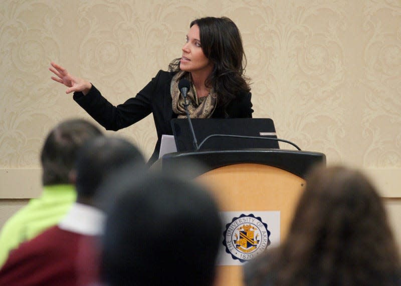 Suzie Graham, president of Downtown Akron Partnership, speaks at a Akron Press Club luncheon at Quaker Station  in 2013.