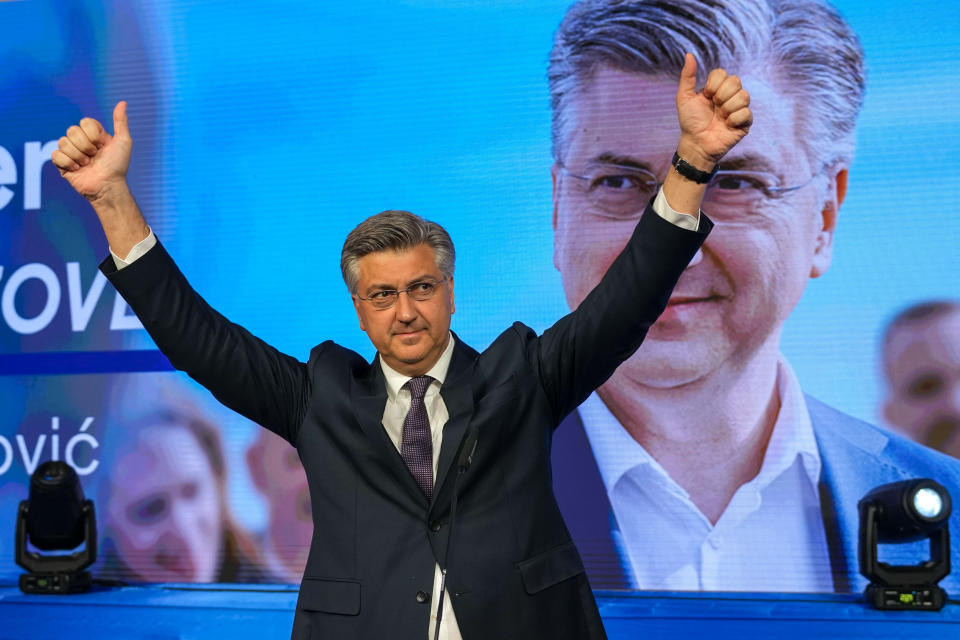 Prime Minister incumbent Andrej Plenkovic waves after claiming victory in a parliamentary election in Zagreb, Croatia, Thursday, April 18, 2024. Croatia's governing conservatives convincingly won a highly contested parliamentary election Wednesday, but will still need support from far-right groups to stay in power, according to the official vote count. The election followed a campaign that centered on a bitter rivalry between the country's president and prime minister. (AP Photo/Darko Vojinovic)