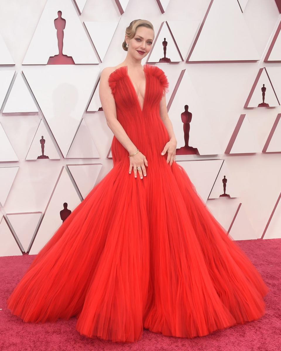 <p>Amanda Seyfried continued her Old Hollywood streak in a bold red Giorgio Armani flared gown featuring a deep V-neckline. </p>