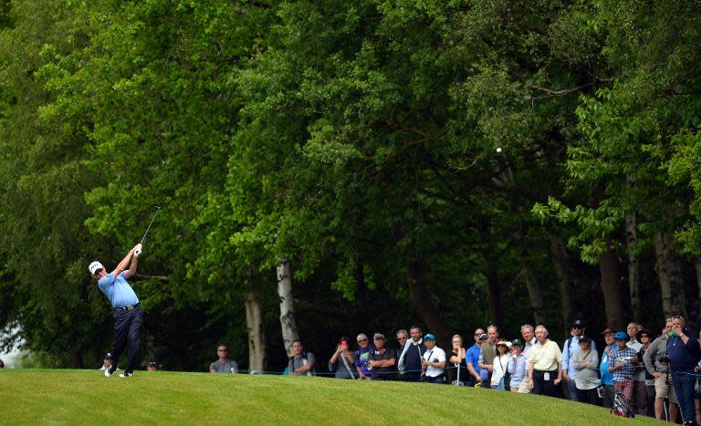 Spanish golfer Miguel Angel Jimenez plays his approach shot to the 4th green during the final round of the BMW PGA Championship at Wentworth Golf Club in Surrey, south west of London, England, on May 24, 2015