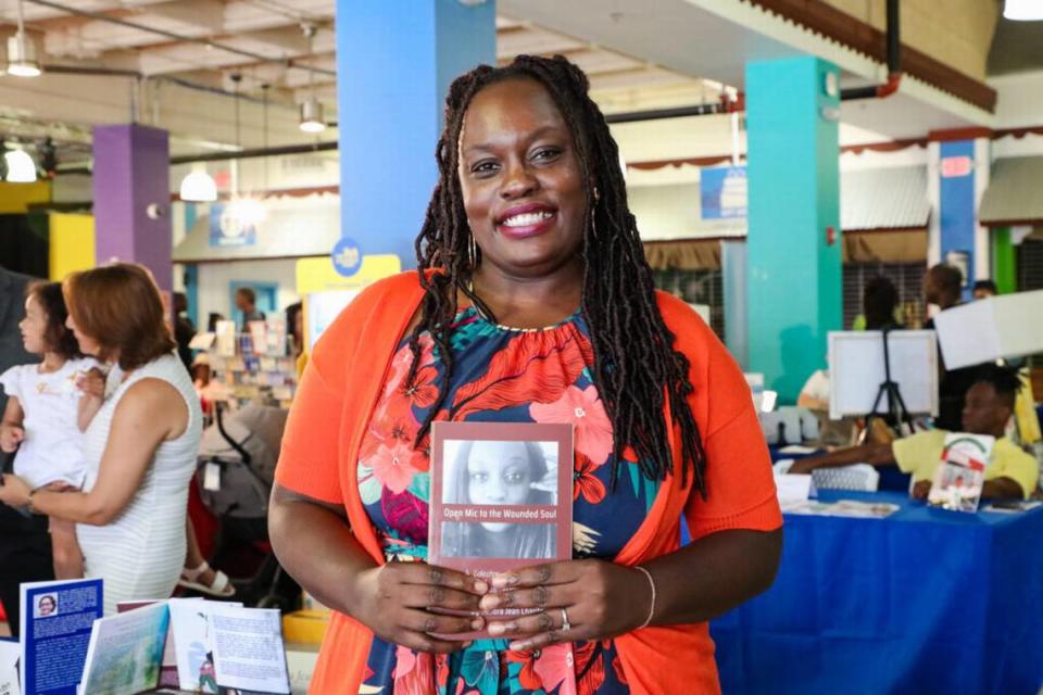 Sandra Jean Charite, an author at the Marketplace at the Little Haiti Book Festival. The festival features books available in several languages including English, Haitian Creole, and French. (Photo courtesy of Miami Dade College/ Miami Book Fair)