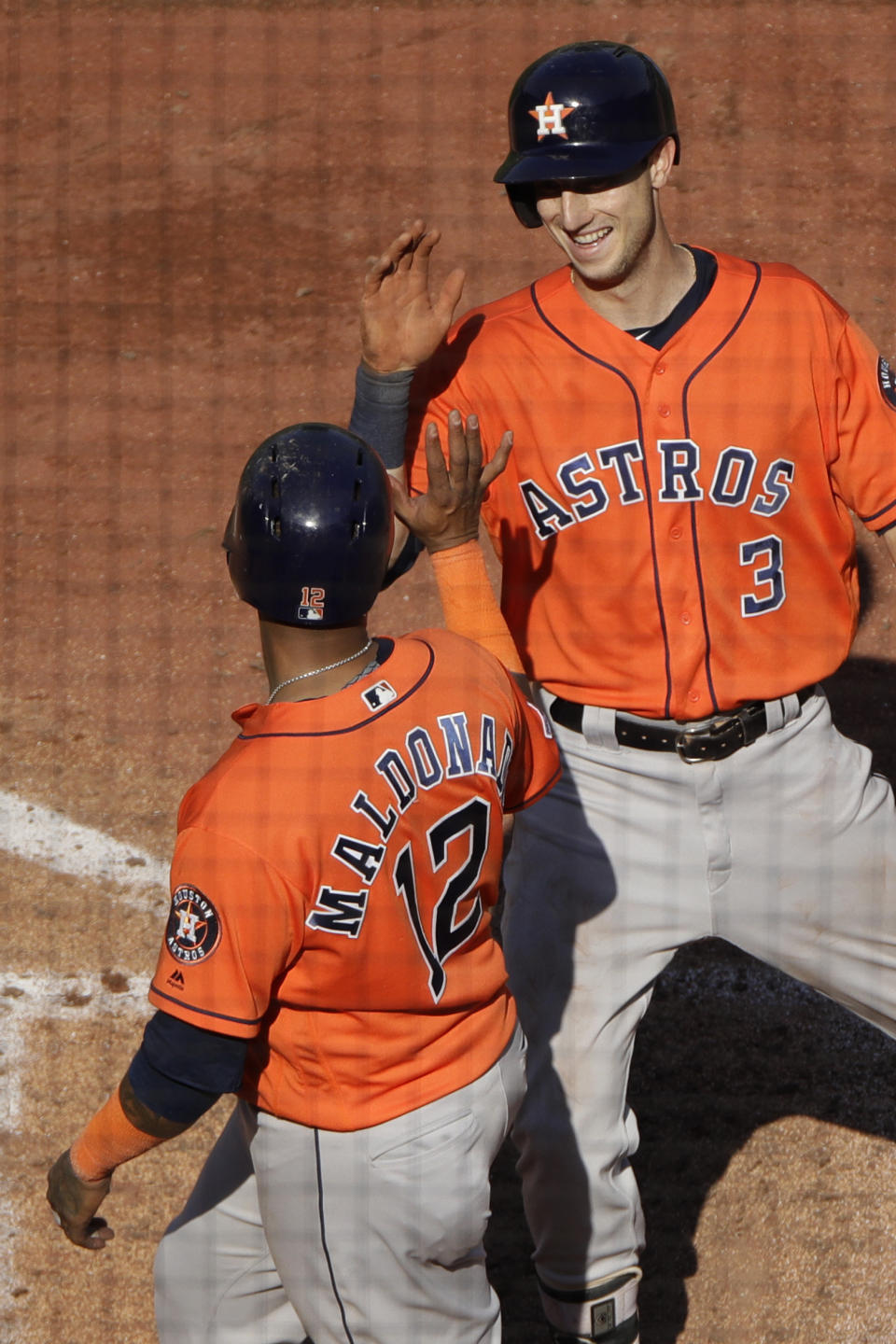 Houston Astros' Kyle Tucker (3) celebrates with Martin Maldonado (12) after hitting a two-run home run during the eighth inning of a baseball game against the Kansas City Royals Sunday, Sept. 15, 2019, in Kansas City, Mo. (AP Photo/Charlie Riedel)
