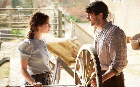 Lily James and Michiel Huisman in The Guernsey Literary And Potato Peel Pie Society