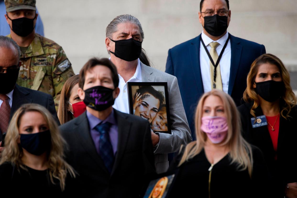 Steve Filson, whose daughter Jessica Filson died in January 2020 of opioids, stands with families who have had relatives die of opioids and authorities during a news conference outside the Roybal Federal Building on February 24, 2021 in Los Angeles, California. (AFP via Getty Images)