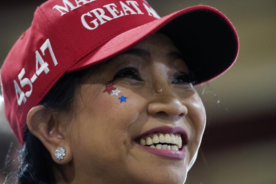 A supporter of former President Donald Trump attends a commit to caucus rally, Wednesday, Sept. 20, 2023, in Maquoketa, Iowa. (AP Photo/Charlie Neibergall)