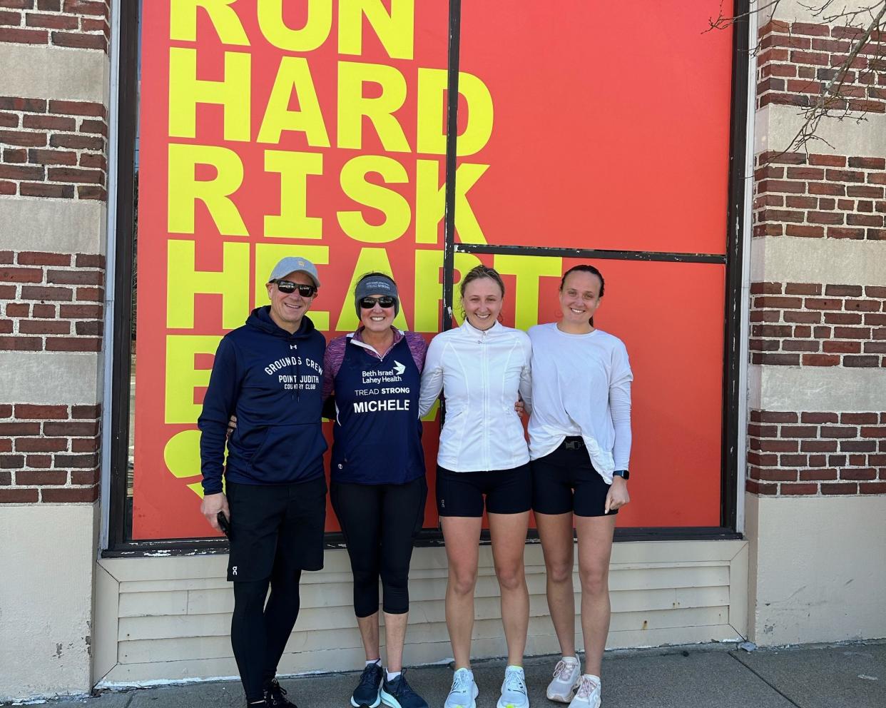 Jim and Michele Gilbert with daughters Madison and Kendall in Boston, where on Monday they will run the 128th annual Boston Marathon.