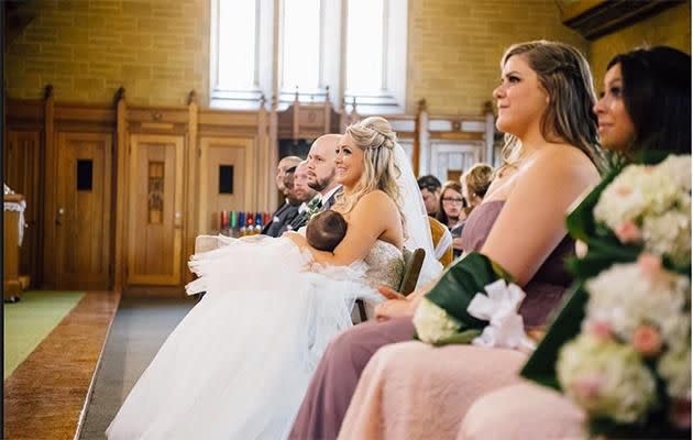 Christina breastfeeding her daughter Gemma during the ceremony. Photo: Lana Nimmons,