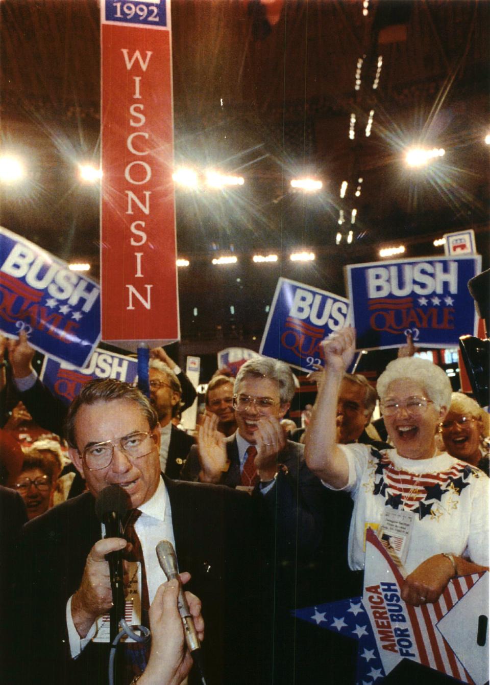 Wisconsin Governor Tommy G Thompson casts the state's 35 delegate votes for President George Bush Wednesday night at the Republican National Convention in Houston, Cheering him on at the right is state Senator Margaret Farrow (R-Elm Grove). Wisconsin's delegation is a fairly diverse group.