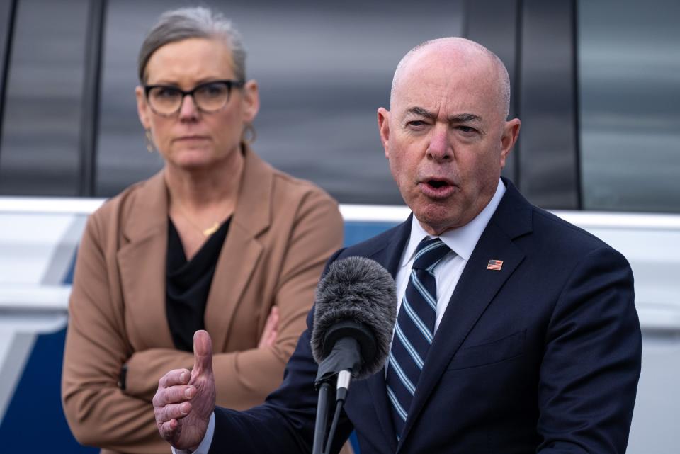 Arizona Governor Katie Hobbs, left, and Secretary of the Department of Homeland Security Alejandro N. Mayorkas, right, attend a press conference at the U.S. Customs and Border Protection Mariposa Port of Entry in Nogales on March 21, 2023.