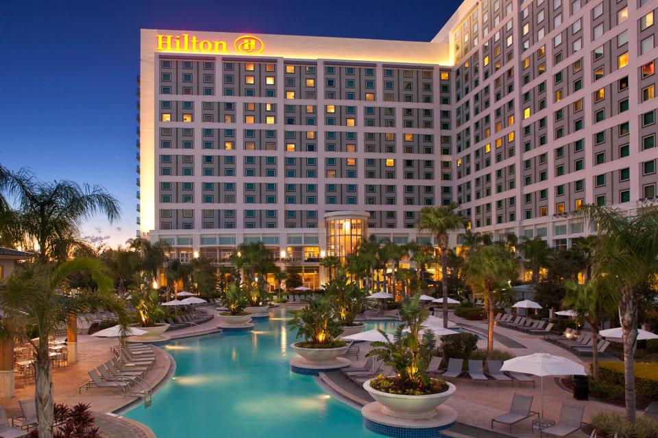 Exterior and pool view in the evening of Hilton Orlando