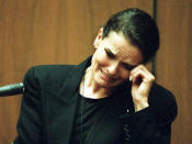 <p>Denise Brown, sister of murder victim Nicole Brown-Simpson, cries as she testifies on the witness stand during the O.J. Simpson murder trial Feb. 3 in Los Angeles, Calif. Brown had recalled an incident she witnessed when O.J. Simpson became angry at his ex-wife, throwing her to the ground outside their home. (Photo: Pool/AFP/Getty Images) </p>