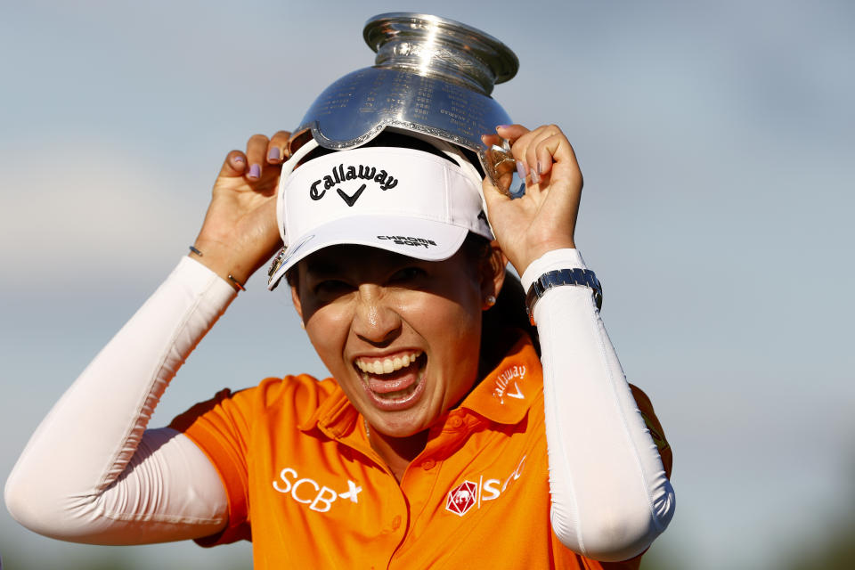 Atthaya Thitikul of Thailand celebrates with the Vare trophy after the CME Group Tour Championship at Tiburon Golf Club on November 19, 2023 in Naples, Florida. (Photo by Douglas P. DeFelice/Getty Images)