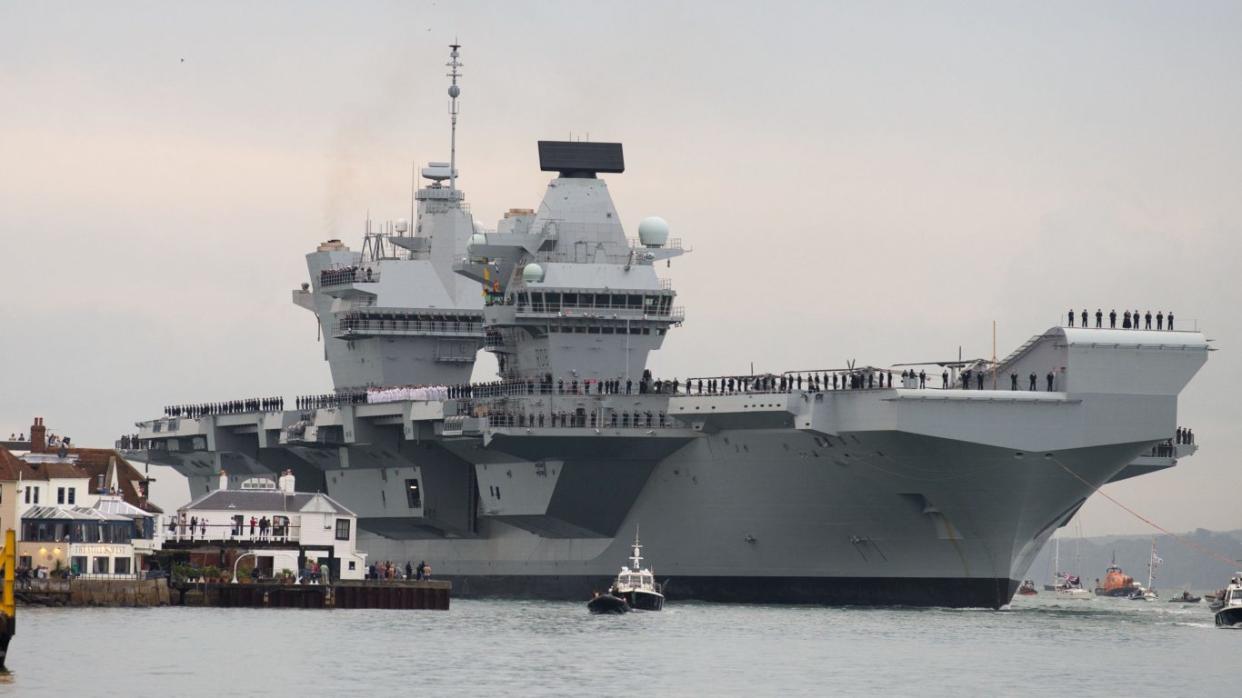 HMS Queen Elizabeth, the UK's newest aircraft carrier, arrives in Portsmouth for the first time (Steve Parsons/PA)