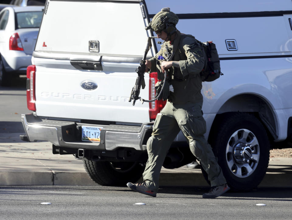 Police patrol on Maryland Parkway after a shooting that killed several people on the University of Nevada, Las Vegas campus in Las Vegas, Wednesday, Dec. 6, 2023. The attack just before noon sent police swarming onto the campus, which is just a couple of miles from the world-famous Las Vegas Strip while students barricaded themselves in classrooms. (K.M. Cannon/Las Vegas Review-Journal via AP)