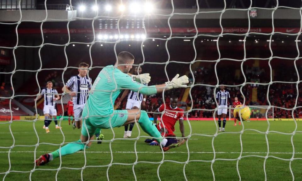 Sadio Mané scores for Liverpool in the first half.