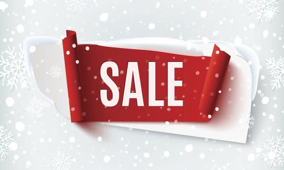 The word Sale in the center of the image, surrounded by snowflakes.