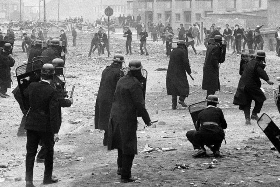 Police and rioters fight in Londonderry in 1969 (PA)