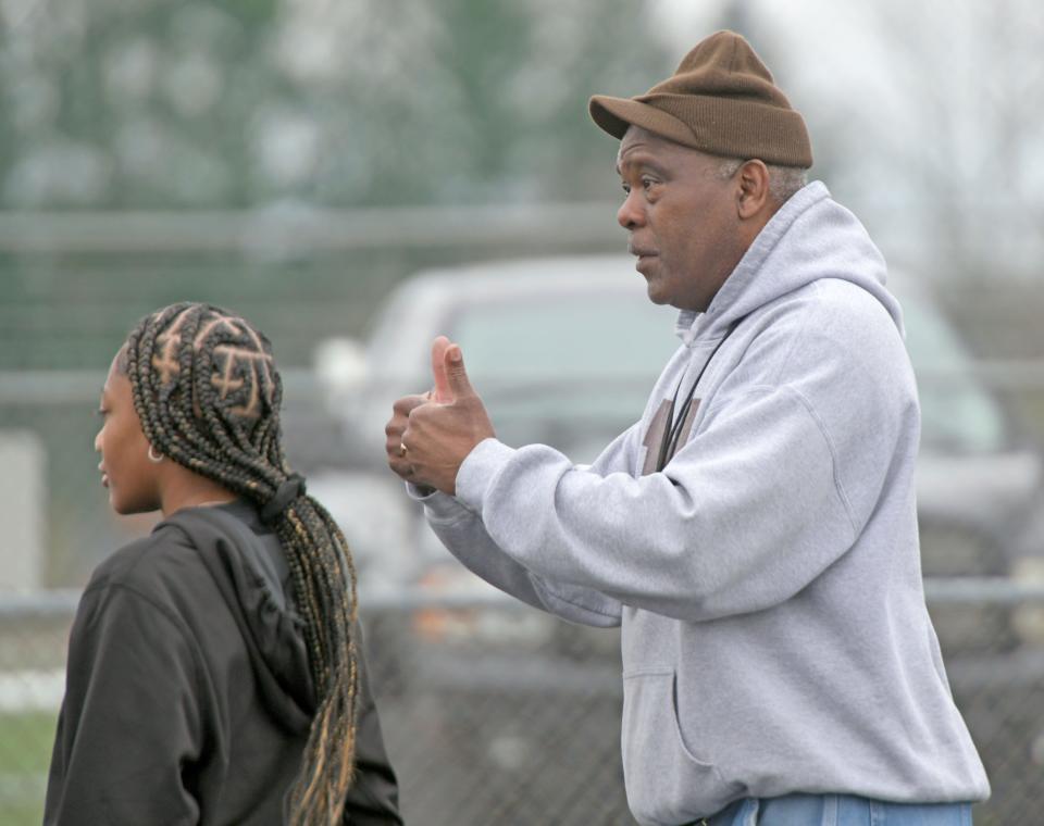 Tygers track coach Tyree Shine gives two thumbs up to an athlete Thursday afternoon.