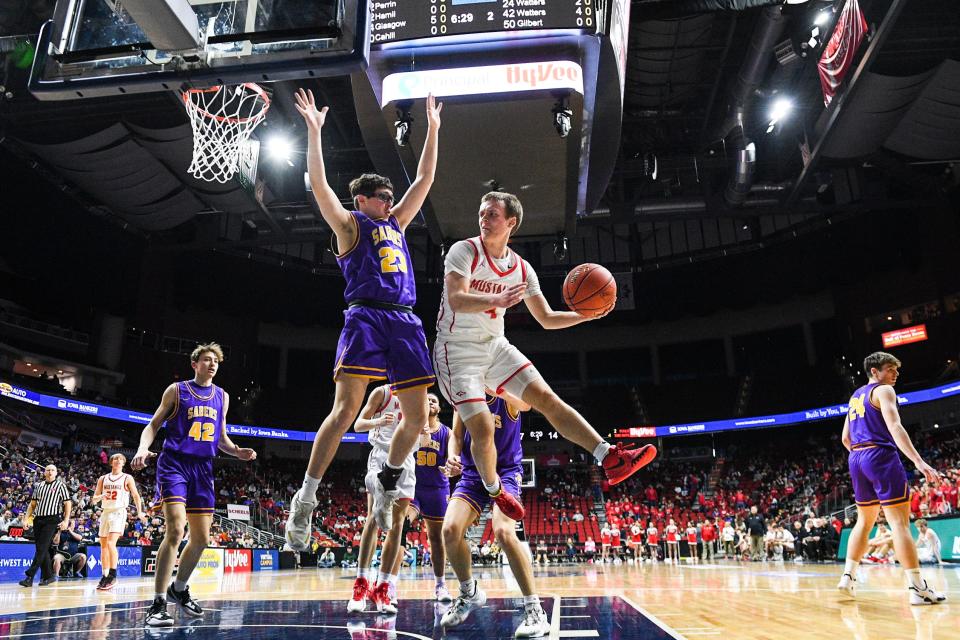 Central DeWitt's Gus Pickup (23) guards Dallas Center-Grimes' Jacob Runyan (4) during the Class 3A Iowa high school boys basketball championship game at Wells Fargo Arena Friday, March 11, 2022, in Des Moines.