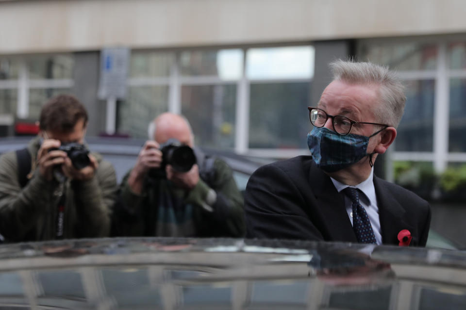 Chancellor of the Duchy of Lancaster Michael Gove wears a face mask as he leaves a branch of Pret A Manger in Westminster, London.