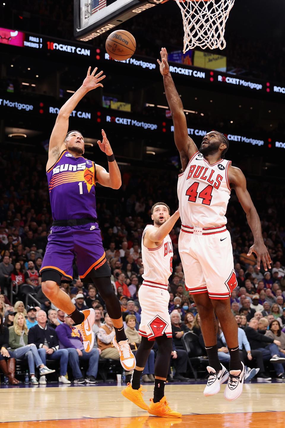 Devin Booker #1 of the Phoenix Suns puts up a shot over Patrick Williams #44 of the Chicago Bulls during the first half of the NBA game at Footprint Center on Nov. 30, 2022, in Phoenix, Arizona.