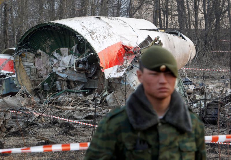 FILE PHOTO: Russian serviceman stands guard near part of the wreckage of a Polish government Tupolev Tu-154 aircraft that crashed near Smolensk airport