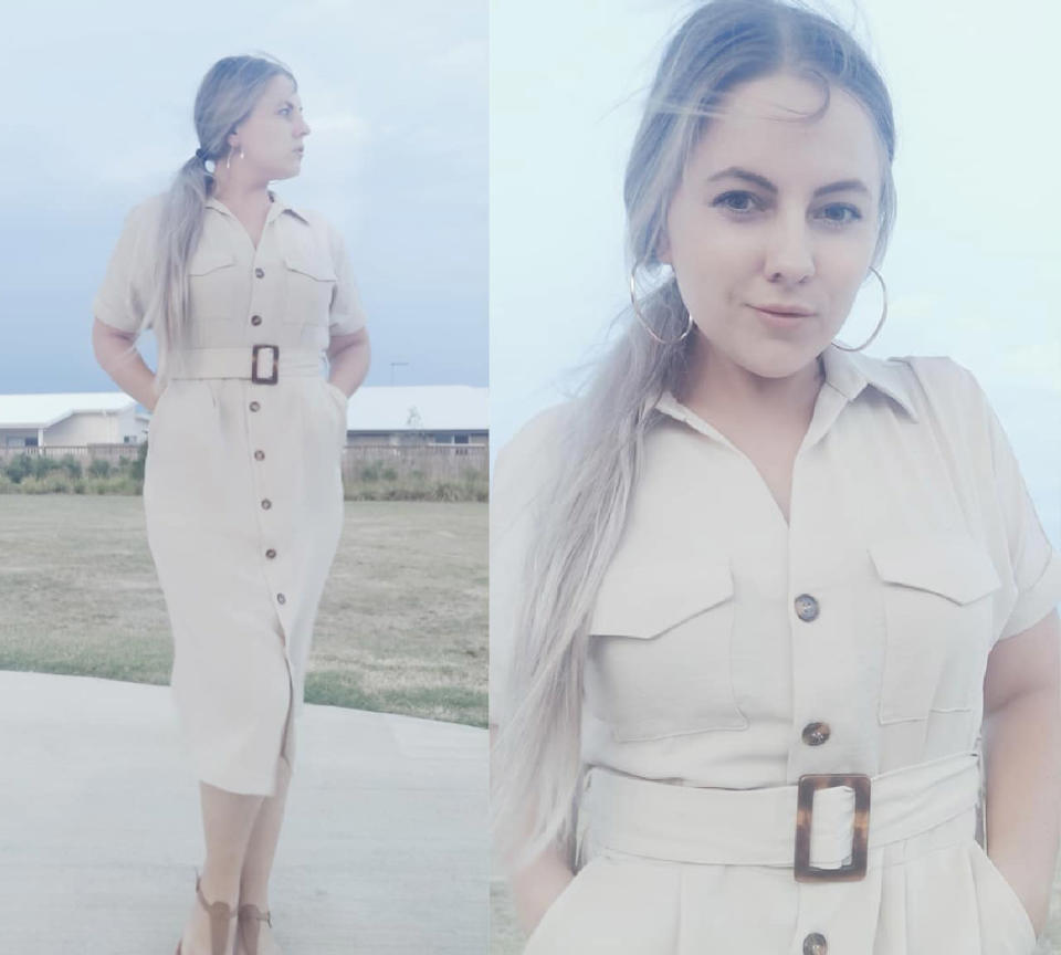 Woman poses in cream Kmart dress