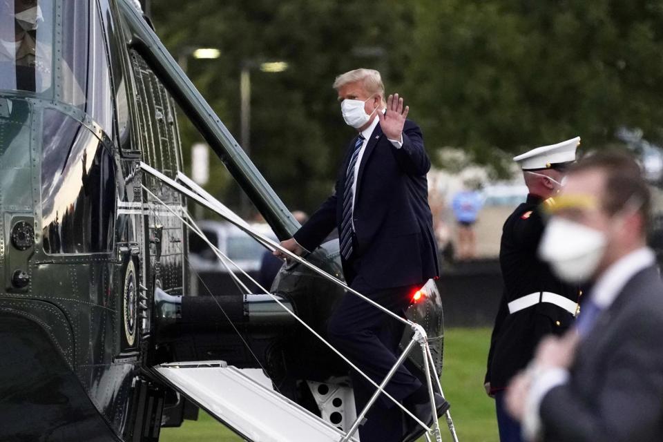 Mr Trump boards Marine One to return to the White House after receiving treatment for coronavirus (AP)