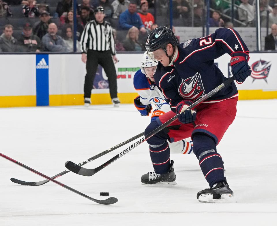 Feb. 25, 2023; Columbus, Ohio, USA; Columbus Blue Jackets left wing Patrik Laine (29) is defended by Edmonton Oilers right wing Kailer Yamamoto (56) during the third period of Saturday's hockey game at Nationwide Arena. Mandatory Credit: Barbara J. Perenic/Columbus Dispatch