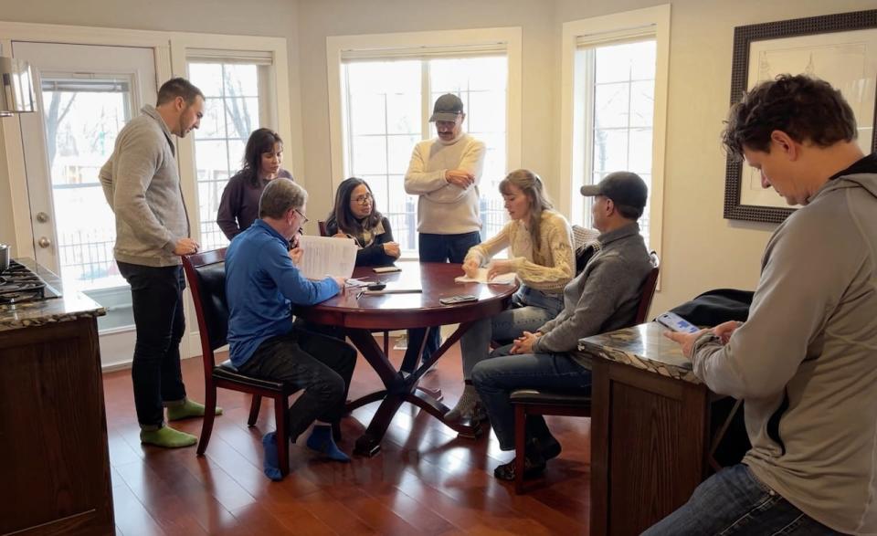 A group of River Run townhome owners meet to discuss the latest development in the expropriation of their homes by the city of Calgary.