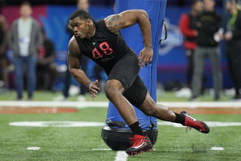 FILE - Georgia defensive lineman Travon Walker runs a drill during the NFL football scouting combine, Saturday, March 5, 2022, in Indianapolis. Walker is expected to be taken in the NFL Draft. (AP Photo/Darron Cummings, File)