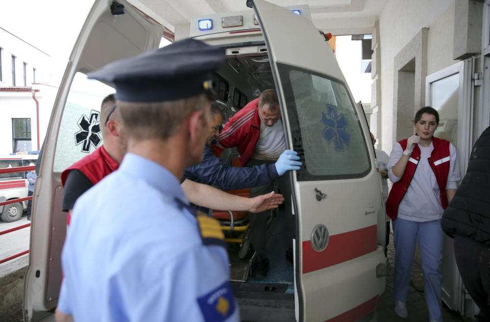 A handcuffed Kosovo Serb man is brought to the hospital in southern Mitrovica, Kosovo, on Tuesday, May 28, 2019. Serbia has put its troops on full alert after heavily armed Kosovo police entered Serb-dominated northern Kosovo, firing tear gas and arresting about two dozen people. It was the latest flare-up in long-simmering tensions between Serbia and its former province, which declared independence from Belgrade in 2008 after a bloody 1998-99 war that ended only with NATO intervention. (AP Photo/Visar Kryeziu)