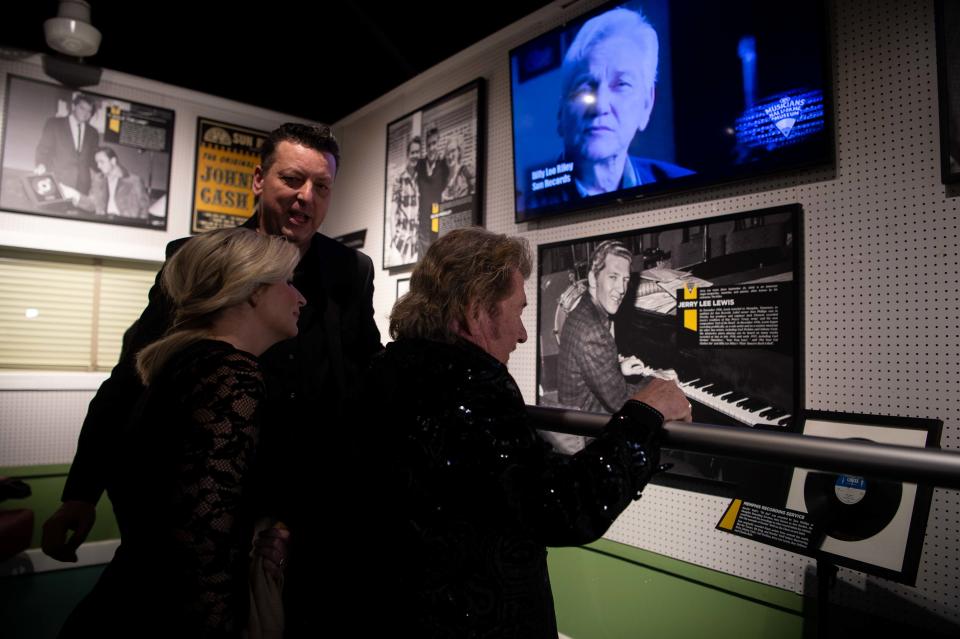 Jerry Philips looks at the Sun Record's exhibit with his daughter Halley and Jay McDowell at the Musicians Hall of Fame in Nashville.