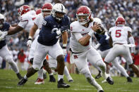 Rutgers quarterback Noah Vedral (0) scrambles away from Penn State defensive tackle Coziah Izzard (99) during an NCAA college football game in State College, Pa., Saturday, Nov. 20, 2021. Penn State won 28-0. (AP Photo/Barry Reeger)