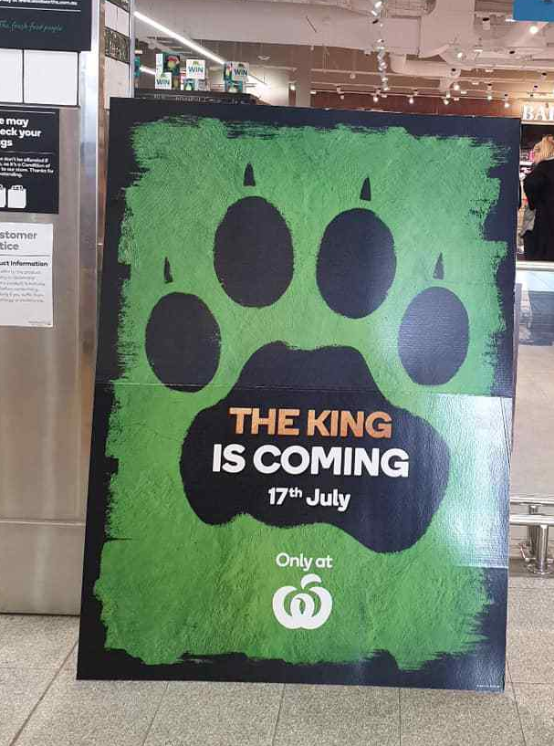 A poster outside a Woolworths store teases its new Lion King collectables earlier this month. 