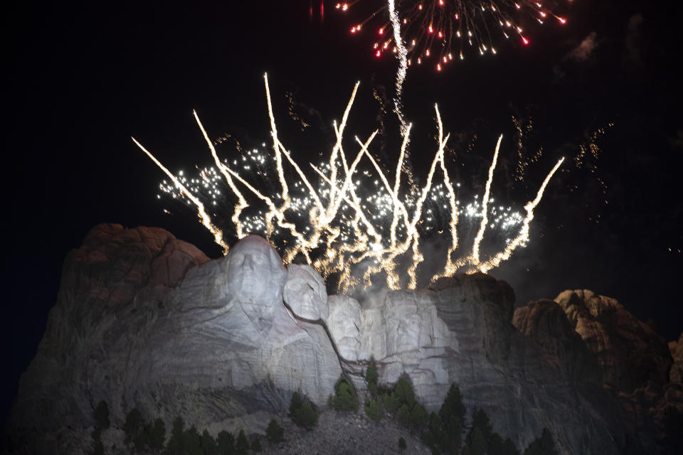 FILE - In this July 3, 2020, file photo, fireworks light the sky over the Mount Rushmore National Memorial near Keystone, S.D. South Dakota Gov. Kristi Noem sued the U.S. Department of Interior on Friday, April 30, 2021, in an effort to see fireworks shot over Mount Rushmore National Monument on Independence Day. The Republican governor successfully pushed last year for a return of the pyrotechnic display after a decade long hiatus. (AP Photo/Alex Brandon File)