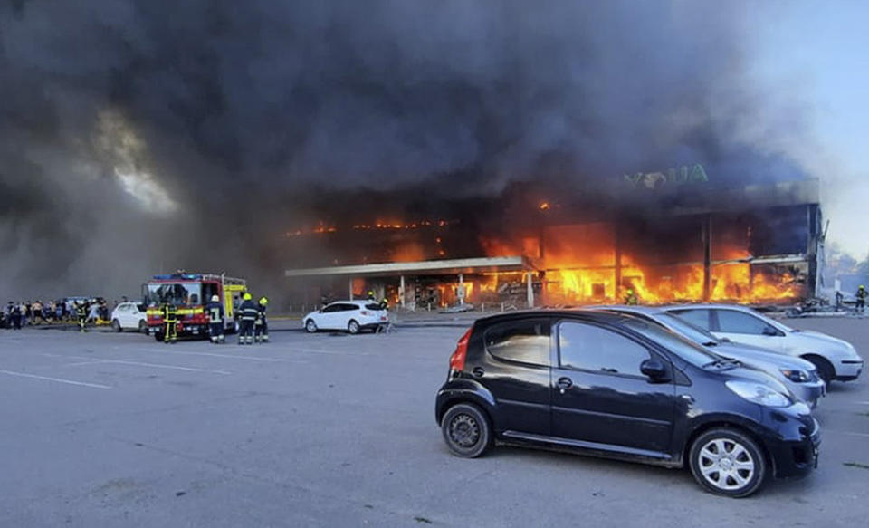 Firefighters work to extinguish a fire at a shopping center (Ukrainian State Emergency Service via AP)