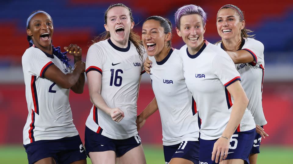 Rapinoe and her USWNT teammates celebrate following the team's penalty shootout victory in the quarterfinals of the Tokyo 2020 Olympic Games. - Laurence Griffiths/Getty Images