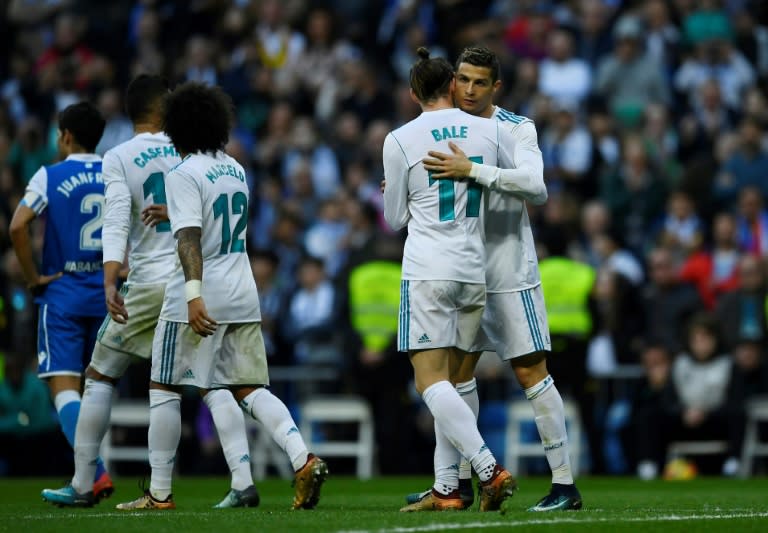 Real Madrid's forward Cristiano Ronaldo (R) celebrates with Gareth Bale during the Spanish league football match against Deportivo on January 21, 2018